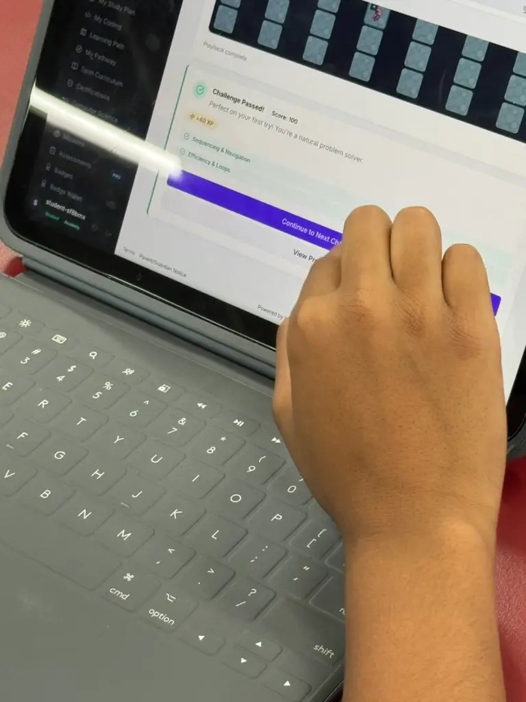 A student working through a guided programming activity on a laptop
